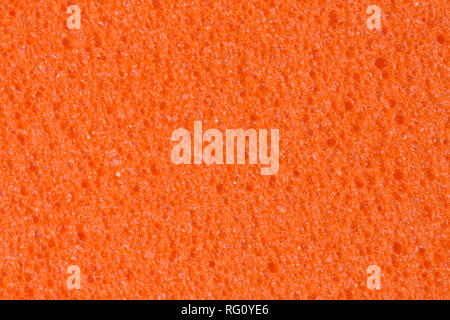 Warm orange foam EVA texture with porous surface for your unique project. Stock Photo