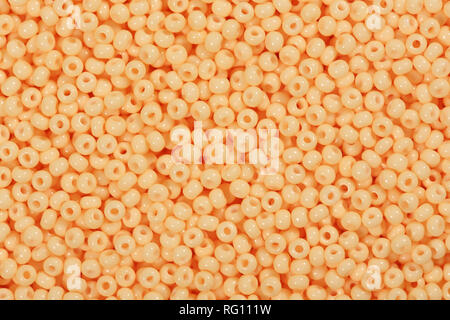 Dark orange seed beads for your unique project. Stock Photo