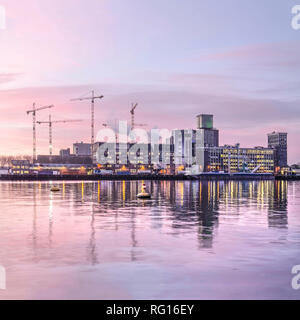 Rotterdam, The Netherlands, January 18, 2019: square image of Rijnhaven harbour and the grainsilo at Katendrecht at sunrise Stock Photo
