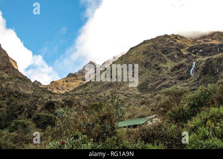 Breathtaking view of the andean landscape following the world famous hiking trail Inca Trail in Peru, through a mysterious landscape of cloud forest Stock Photo