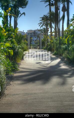 HDR image of the tree lined entrance to EL Cason the clubhouse, bar and restaurant at Hacienda Riquelme Golf Resort Stock Photo