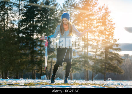 Woman walking thru slushy snow Stock Photo
