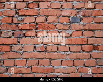 Red brick wall, masonry background with rough seams Stock Photo