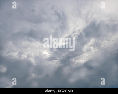 Grey and bluish tragic cloudscape with various density chaotic clouds Stock Photo
