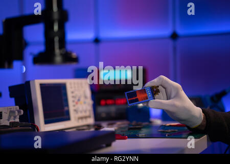 Check electronics device in industrial lab Stock Photo
