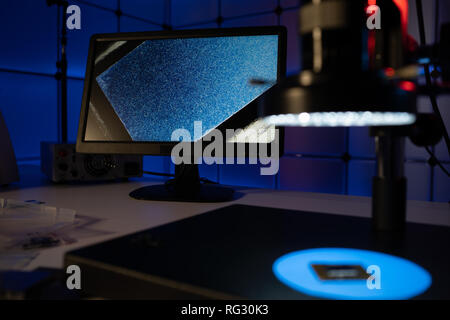 Laboratory of semiconductor chips. The development of modern electronics. crystal chip in the microscope Stock Photo