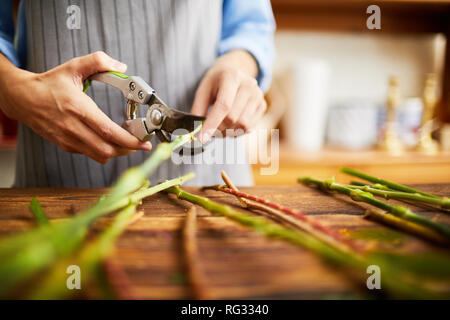 Florist Cutting Stems Closeup Stock Photo
