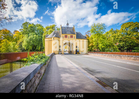 Smedenpoort, a city gate of Bruges surrounded by water. Stock Photo