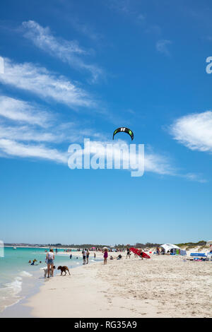 People on Whitfords beach enjoying the sunny and warm weather,  Perth, Western Australia. Stock Photo