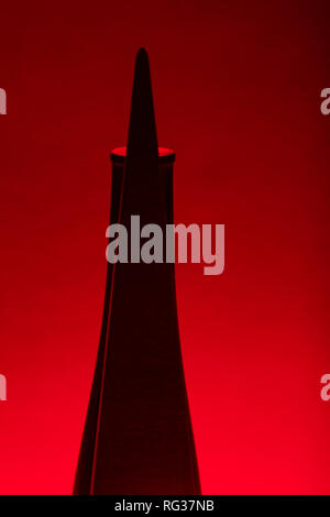 Light study of wooden object d'art with back lighting in red. Stock Photo