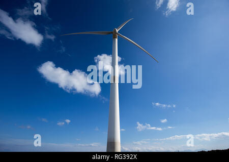 wind turbine over Elounda VIllage Crete Greece Stock Photo
