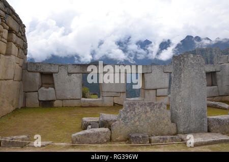 MACHU PICCHU / PERU, August 16, 2018: Sacred Plaza of Machu Picchu  overlooks the mountains Stock Photo