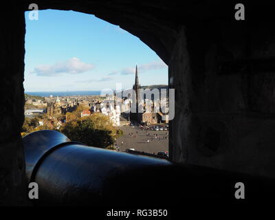 View of Edinburgh through a cannon embrasure from the Edinburgh Castle - Scotland Stock Photo