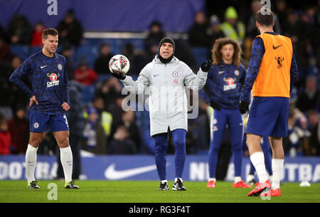 Chelsea assistant manager Gianfranco Zola (centre) during the warm up before the FA Cup fourth round match at Stamford Bridge, London. Stock Photo