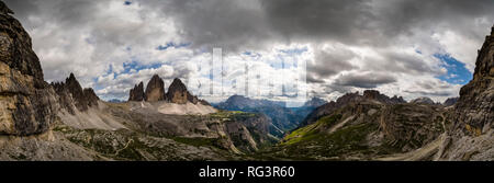Panoramic view on the mountain group Tre Cime di Lavaredo, dark thunderstorm clouds approaching Stock Photo