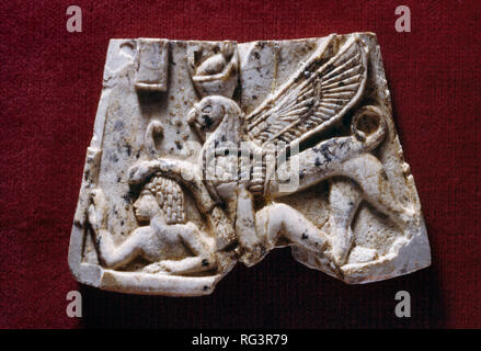 Sphinx subdues boy: Nimrud Ivory from Room SW37 Fort Shalmaneser within the Assyrian city of Nimrud, northern Iraq, photographed in Birmingham Museum. Stock Photo
