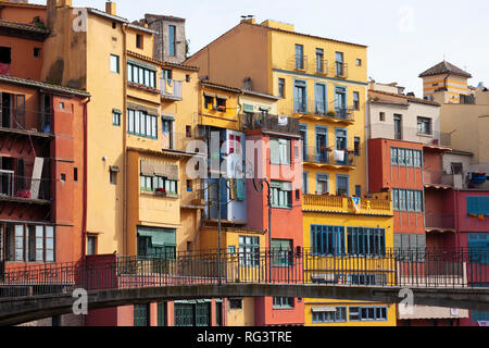 Girona, Spain - January 23, 2019: Colorful houses of Girona in center of city en embankment of Onyar River Stock Photo