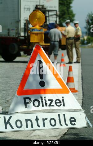 DEU, Germany, NRW: Controll of trucks at the highway A4 near Cologne. The police officers check the security of the cargo, the Stock Photo