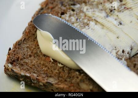 DEU, Germany : wholemeal bread, butter. Stock Photo