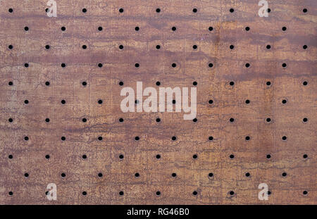 Old, rusty, perforated metal texture Stock Photo