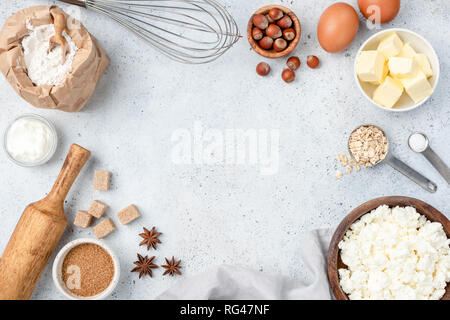 Baking concept, baking ingredients on background. Ingredients for baking cake, cookies, bread or pastry. Frame of cooking kitchen utensils and food Stock Photo