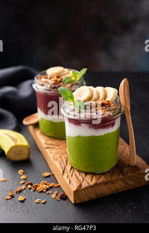 Rainbow Avocado spinach and acai breakfast smoothie in jar. Healthy eating, healthy lifestyle, dieting and vegetarian food concept Stock Photo