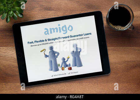 The Website Of Amigo Loans Is Seen On An Ipad Tablet Which Is Resting On A Wooden Table Editorial Use Only Stock Photo Alamy