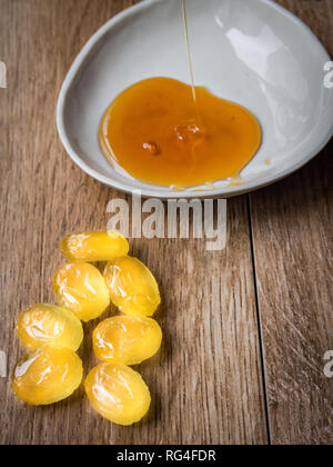 Honey candies on wood background Stock Photo