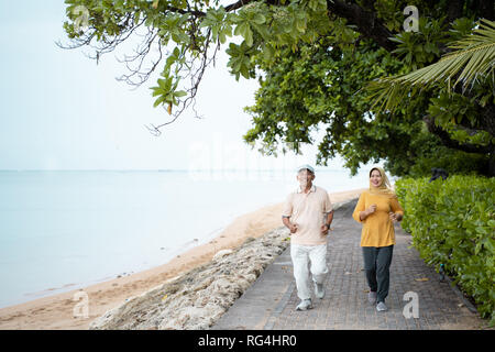 muslim mature couple doing jogging together Stock Photo