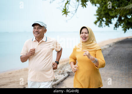 muslim mature couple doing jogging together Stock Photo