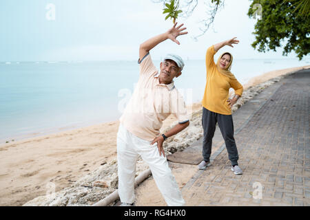 muslim senior couple doing stretching and exercising outdoor  Stock Photo
