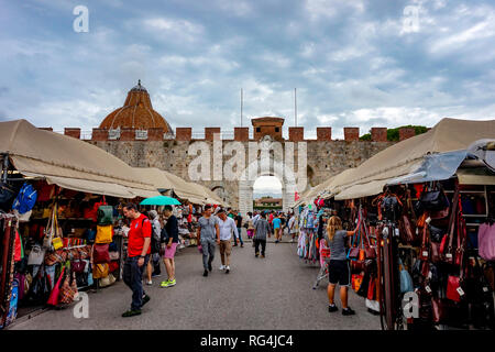 Pisa, Tuscany / Italy - 09.15.2017: Souvenirs for sale at stalls close to the Leaning Tower of Pisa before the square gate Stock Photo