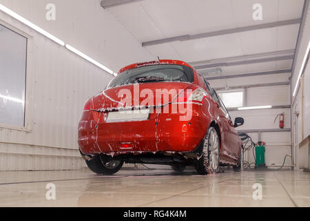 Car washing concept. Red car in foam Stock Photo - Alamy