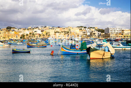 The famous port of Marsaxlokk in the island of Malta, where are the typical boats called 'Luzzu ' Stock Photo