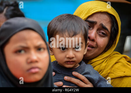 January 22, 2019 - Tripura, India, 22 January 2018. 31 Rohingya who were stranded on the India-Bangladesh border for three days, are held at the Amtali Police Station after they were arrested by Indian Border Security Force (BSF) and handed over to the Tripura Police on Tuesday. The Rohingya were detained by the Bangladeshi Border Guards in no-man's land, between the international borders of India and Bangladesh along West Tripura district as both countries refused to accept them, until Tuesday morning when BSF agreed to arrest them and to hand them over to the police, ending a standoff with t Stock Photo