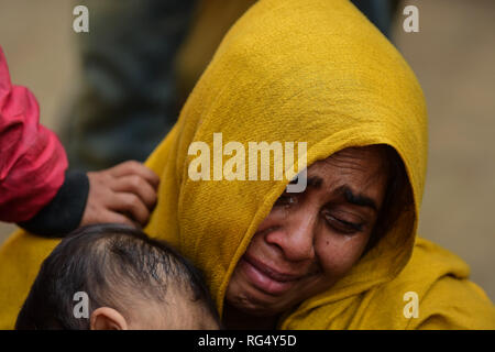 January 22, 2019 - Tripura, India, 22 January 2018. 31 Rohingya who were stranded on the India-Bangladesh border for three days, are held at the Amtali Police Station after they were arrested by Indian Border Security Force (BSF) and handed over to the Tripura Police on Tuesday. The Rohingya were detained by the Bangladeshi Border Guards in no-man's land, between the international borders of India and Bangladesh along West Tripura district as both countries refused to accept them, until Tuesday morning when BSF agreed to arrest them and to hand them over to the police, ending a standoff with t Stock Photo