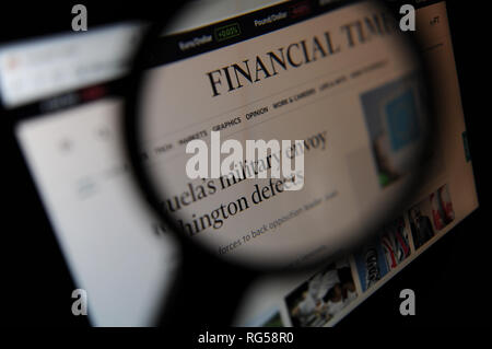 The Financial Times website seen through a magnifying glass Stock Photo