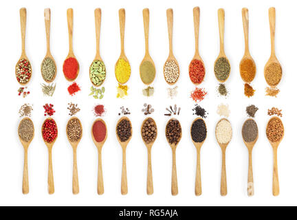 mix of spices in wooden spoon isolated on a white background. Top view. Flat lay. Set or collection. Stock Photo
