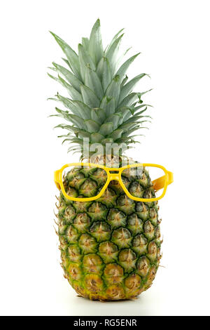 Pineapple wearing a pair of yellow eyeglasses Stock Photo