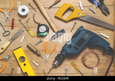 Various tools on wooden background - top view Stock Photo