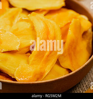 Dried Mango Fruit on Old Wooden Background Stock Photo