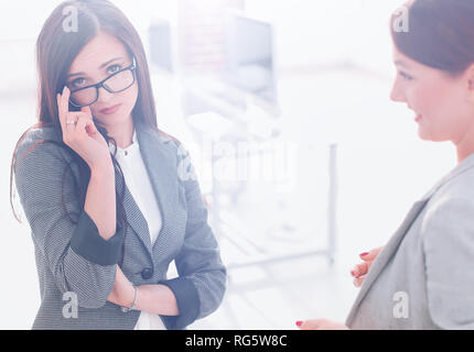 two employees on a blurred office background Stock Photo