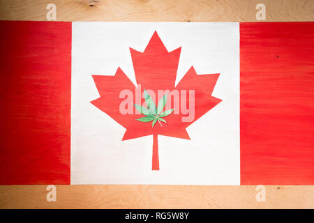 cannabis leaf on canadian flag, marijuana legalization concept Stock Photo