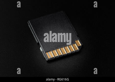 SD card closeup on a black background, with selective lighting Stock Photo