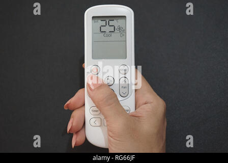Set temperature in remote control of air conditioner Stock Photo