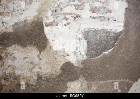old medieval plaster and brick wall in shadow Stock Photo