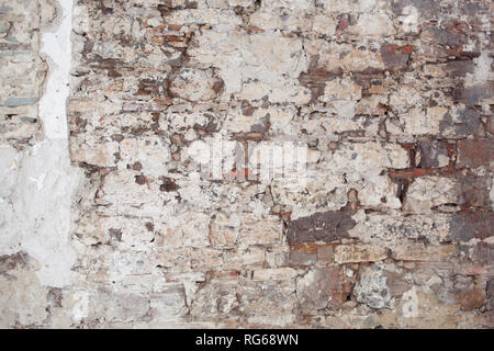 old medieval plaster and brick wall in shadow Stock Photo