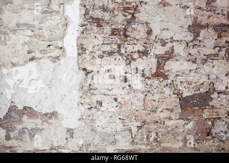 old medieval plaster and brick wall in shadow Stock Photo