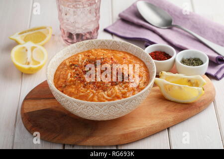Lentil Soup with Vermicelli Noodles, spices, and sliced lemon Stock Photo