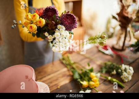 Florist Arranging Flowers Closeup Stock Photo